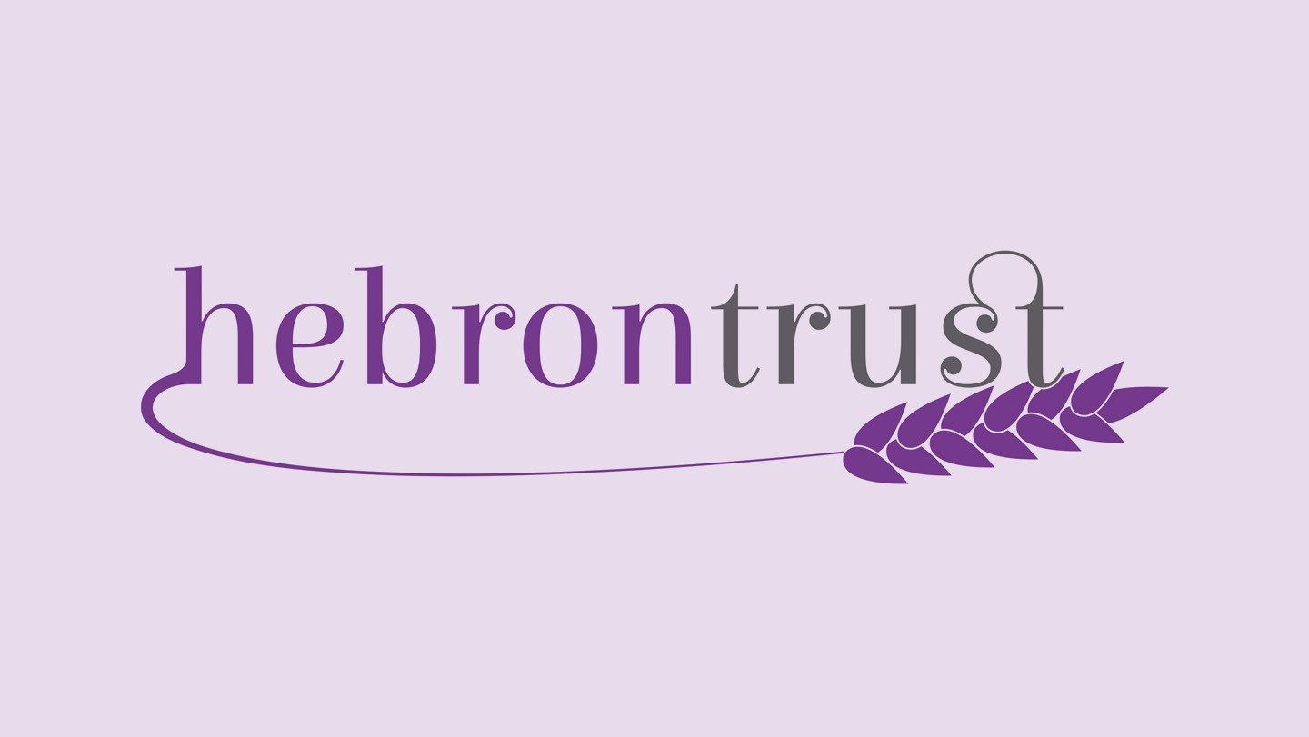 Hebron Trust logo on a light purple background