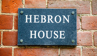 A door plaque for Hebron House