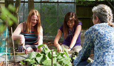 Women tending to a vegetable patch